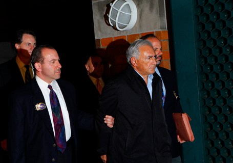 International Monetary Fund (IMF) chief Dominique Strauss-Kahn departs a New York Police Department precinct in New York
