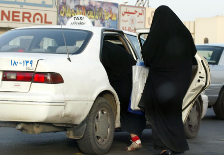 Saudi women board a taxi in Riyadh 14 Ju