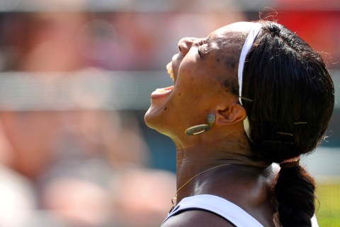 Serena Williams of the U.S. reacts to a missed volley during her match against Marion Bartoli of France at the Wimbledon tennis championships in London