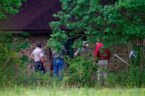 Police investigate a rural home after a psychic called the authorities reporting that bodies were at the scene near Hardin