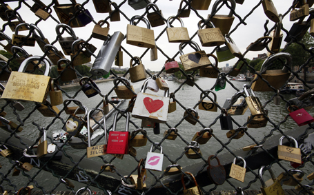 Some of thousands of padlocks clipped by lovers onto the railings of the Pont des Arts bridge over the River Seine in Paris