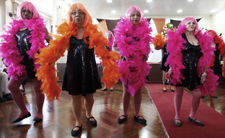 Elderly women perform before a beauty contest for elderly men in Sao Paulo