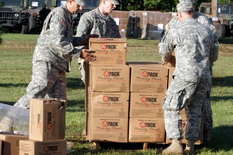 National Guard troops stack emergency provisions  on Tuesday in Colchester, Vt.  