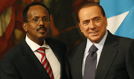 Italian Prime Minister Berlusconi shakes hands with Somalia's Prime Minister Mohamed Abdullahi Mohamed during a meeting at Chigi palace in Rome