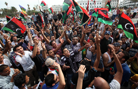 Residents celebrate at Martyrs square in Tripoli