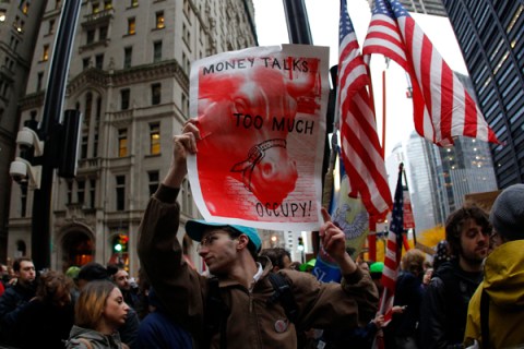 Occupy Wall street demonstrators move through the streets of lower Manhattan near the New York Stock Exchange during what organizers called a "day of action" in New York