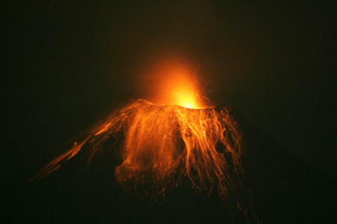 Ecuador's Tungurahua volcano spews volcanic lava accompanied by large clouds of gas and ash near Banos