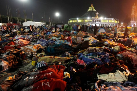Pilgrims sleep at Basilica's square during the celebration of Virgin of Guadalupe's Day in Mexico city