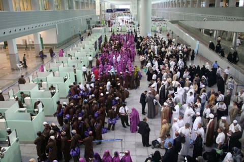 Pilgrims queue upon their arrival at Jeddah airport