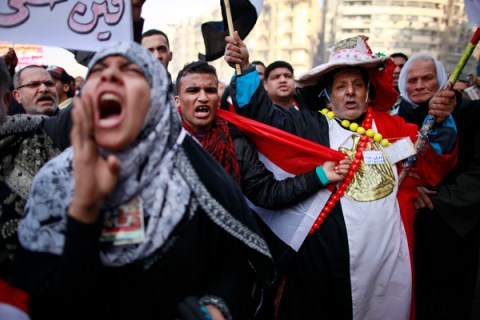 Demonstrators take part in a protest marking the first anniversary of Egypt's uprising at Tahrir square in Cairo