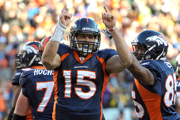 Quarterback Tim Tebow (15) celebrates a score during an NFL game against  the New England Patriots – Denver Broncos History