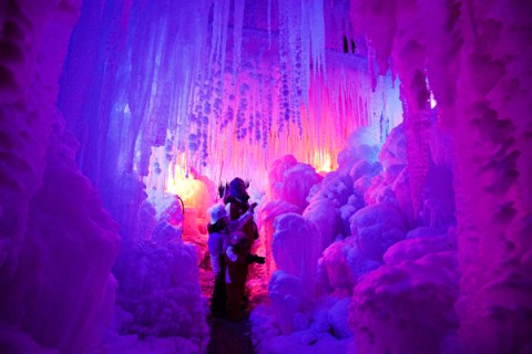 Visitors walk through an illuminated 'ice palace' in Schwarzsee