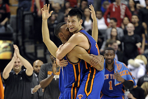 New York Knicks Jeremy Lin and Jered Jeffries celebrate their win against the Toronto Raptors during their NBA basketball game in Toronto