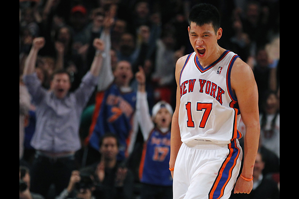 New York Knicks point guard Jeremy Lin reacts after hitting a three-point shot against the Dallas Mavericks in the fourth quarter of their NBA basketball game at Madison Square Garden in New York