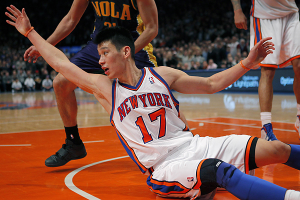 New York Knicks point guard Jeremy Lin looks for a loose ball against the New Orleans Hornets in the second half of their NBA basketball game at Madison Square Garden in New York