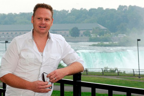 Nik Wallenda poses for a photo before speaking to the media at Niagara Falls