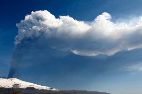 Smoke rises from Mount Etna as it spews lava on the southern Italian island of Sicily