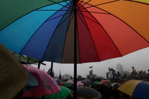 Supporters hold their umbrellas during East Timor's former military commander Taur Matan Ruak's presidential campaign at Letefoho village in Ermera district