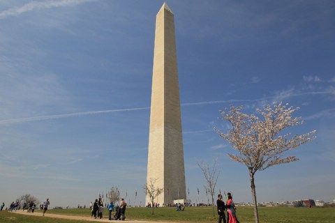 Tourists gather on the grounds of the Washington Monument, on April 7, 2011 in Washington, DC.