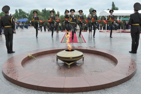 Honour guard soldiers lay a wreath