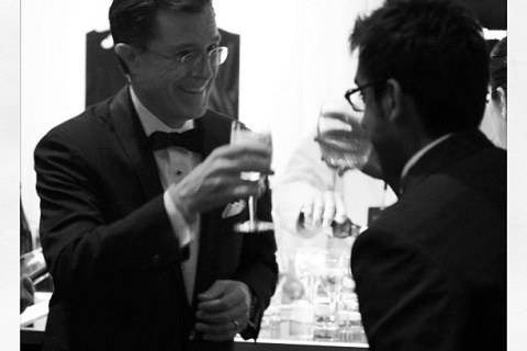 Stephen Colbert toasts with TIME staff writer Ishaan Tharoor at the TIME100 gala.