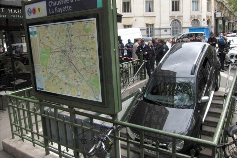 French police gather at scene after car drove into a subway entrance in Paris