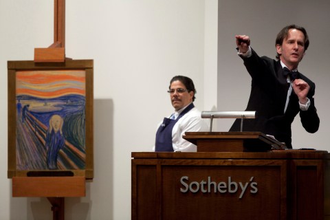 Auctioneer takes bids for the sale of "The Scream" painted by Edvard Munch at Sotheby's in New York