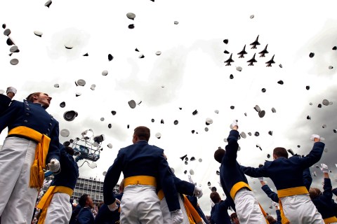 The Thunderbirds perform a fly by as graduates celebrate at the Air Force Academy commencement ceremony in Colorado Springs