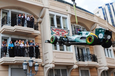 The Caterham Formula One car of driver Heikki Kovalainen of Finland is removed from the track following his crash during the second practice session at the Monaco F1 Grand Prix