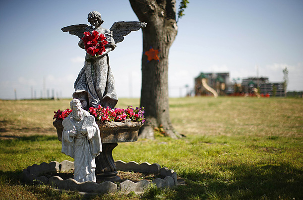Statues are seen with flowers in Joplin