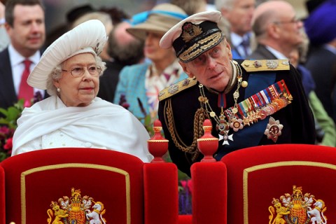 Britain's Queen Elizabeth speaks to her husband Prince Philip on the Spirit of Chartwell during the Diamond Jubilee River Pageant on the River Thames, in London