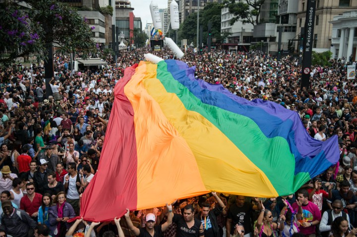 A huge rainbow flag is unfold during the