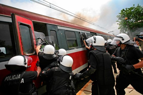 Police practise arresting aggressive soccer fans during a training exercise at the Modlniki station in Krakow