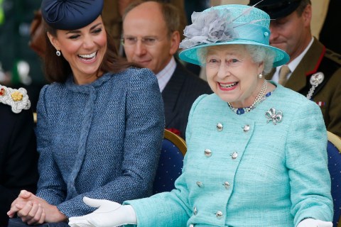 Britain's Catherine, Duchess of Cambridge laughs as Queen Elizabeth gestures while they watch part of a children's sports event during a visit to Vernon Park in Nottingham
