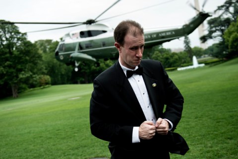 A Secret Service Agent holds his tuxedo