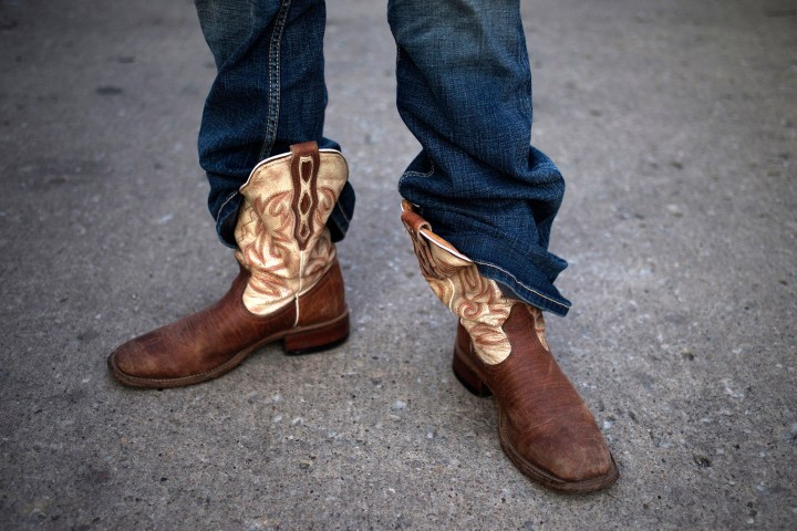 A girl wears her jeans partially outside her boots during the the Iowa 80 truck stop's 33rd Annual Truckers Jamboree in Walcott