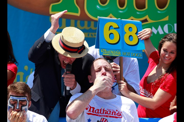 Joey Chestnut competes in the 2012 Nathan's Famous Fourth of July International Eating Contest at Coney Island in the Brooklyn borough of New York