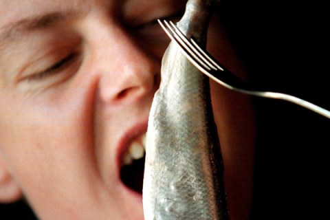 woman eats fermented herring
