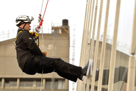 Britain's Prince Andrew abseils down the Shard building, Europe's tallest building, to raise money for educational charity the Outward Bound Trust and the Royal Marines Charitable Trust Fund in London