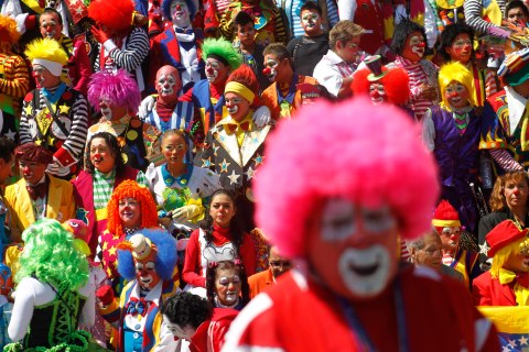 Clowns pose for a photo as they rally for peace during the 17th Latin American clown convention or "Fair of laughter" at the Mother Monument in Mexico City