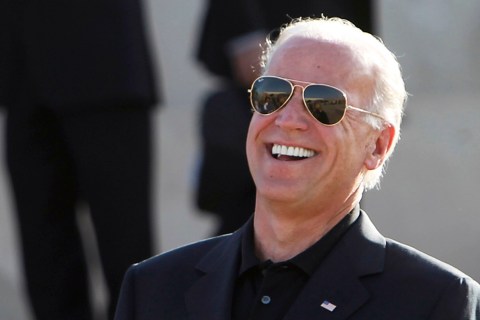 U.S. Vice President Biden laughs with U.S. Senator McCain after Biden's arrival in Baghdad