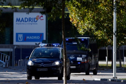 Spanish police vehicles leave the Madrid Arena Stadium in Madrid November 1, 2012.