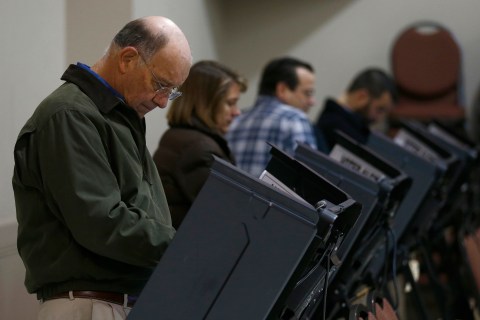 Voters cast their ballots on electric touch screen voting machines at Harrison United Methodist Church during the U.S. presidential election in Pineville