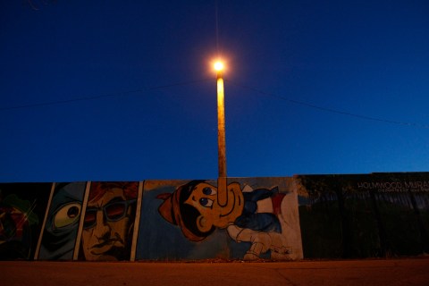 A mural of Pinocchio is pictured in front of a street light at Lansdowne Park in Ottawa