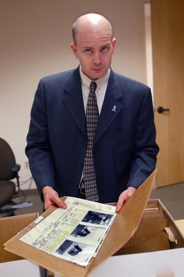 image: FBI Special Agent Fred Humphries in charge of the Ressam case out of Seattle. He's leafing through evidence in the downtown FBI office.