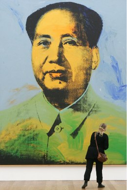 Image: A visitor looks at the painting 'Mao' by Andy Warhol at the Hamburger Bahnhof Contemporary Art Museum March 28, 2007 in Berlin, Germany.