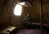 Image: Liu Qiyuan sits inside one of his seven survival pods, December 11, 2012.