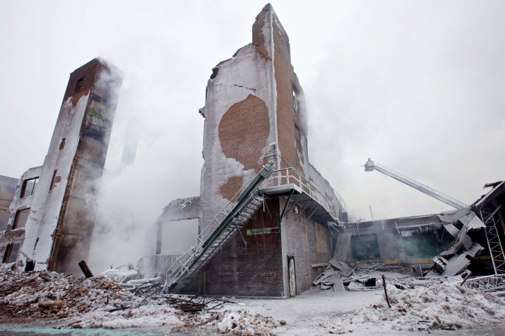Firefighters spray down hot spots on an ice covered warehouse that caught fire in Chicago on Jan 22, 2013. Fire department officials said it is the biggest fire the department has had to battle in years and one-third of all Chicago firefighters were on the scene at one point or another trying to put out the flames. 