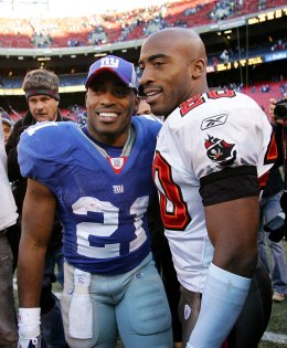 image: Tiki Barber of the New York Giants, left, greets his brother Ronde Barber of the Tampa Bay Buccaneers after the game at Giants Stadium in East Rutherford, N.J., Oct. 29, 2006.