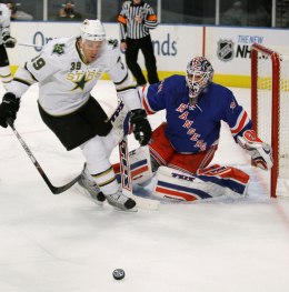 image: Dallas Stars center Joel Lundqvist, left, keeps his eye on a loose puck as his brother, New York Rangers goalie Henrik Lundqvist, sets up to defend the goal during a NHL hockey game at Madison Square Garden in New York, Oct. 20, 2008.